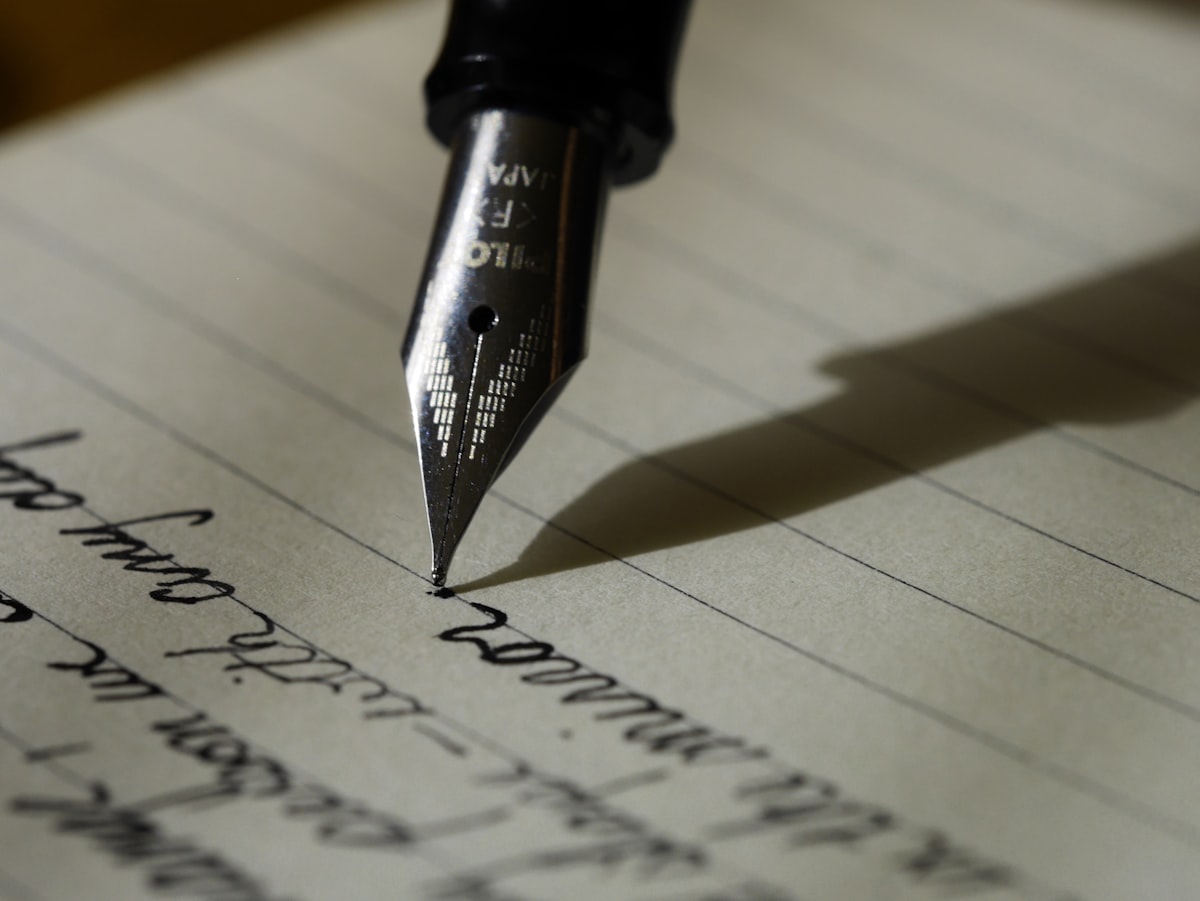 Direction A — The Engraved Letter: fountain pen writing on fine paper